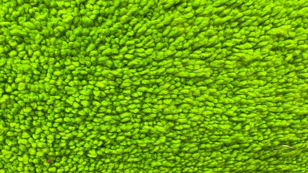 Green Moroccan runner rug in handmade wool shag texture with fringed ends