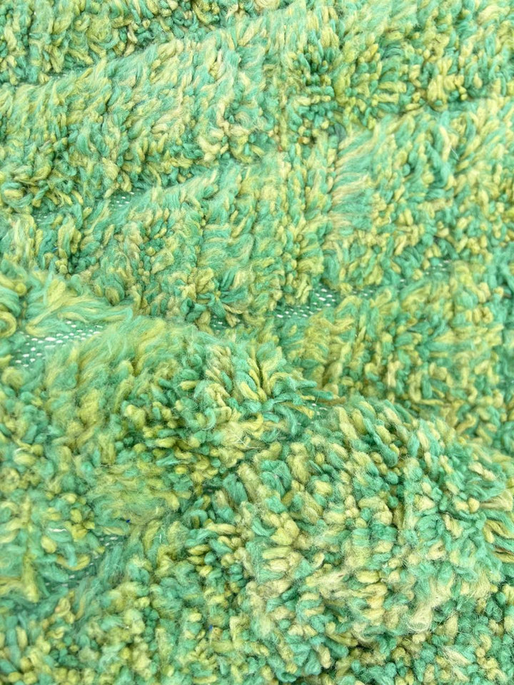 Handwoven green Moroccan wool runner rug with soft tonal textured pattern