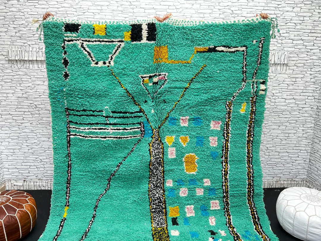 Green Moroccan wool rug with abstract geometric Berber pattern, handmade by artisans