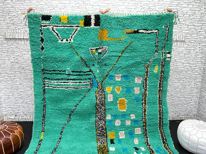 Green Moroccan wool rug with abstract geometric Berber pattern, handmade by artisans