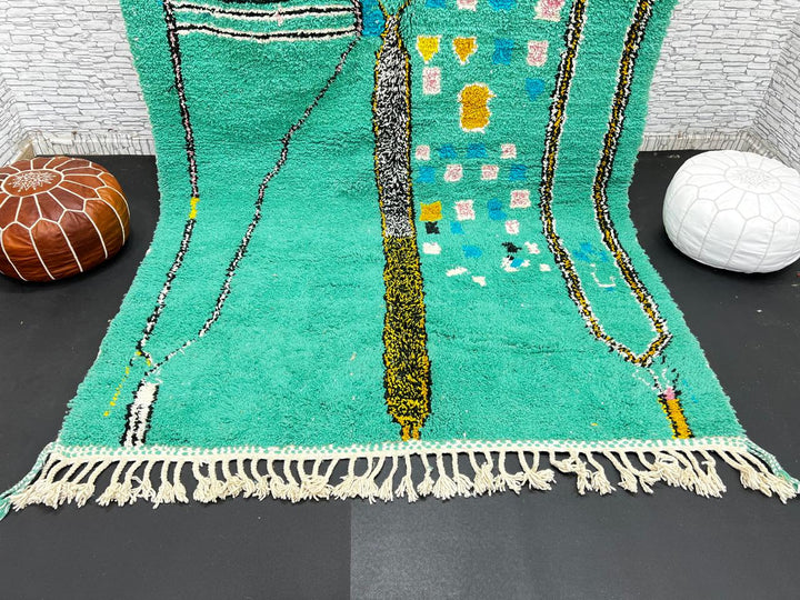 Green Moroccan wool rug with abstract geometric Berber pattern, handmade by artisans