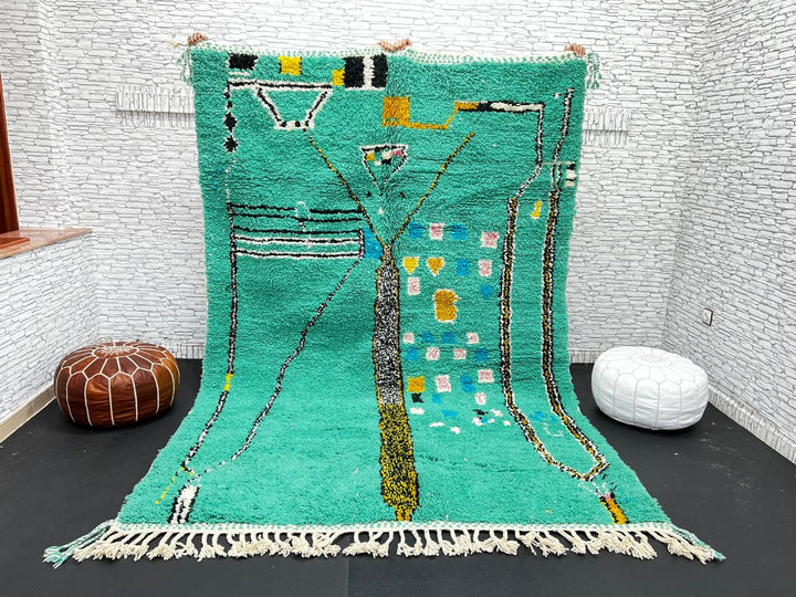 Green Moroccan wool rug with abstract geometric Berber pattern, handmade by artisans
