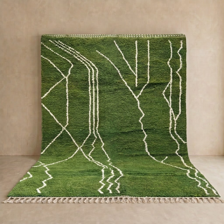 Handwoven green Moroccan wool rug with white geometric line design
