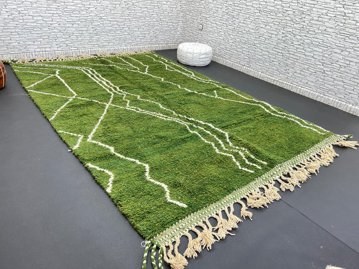 Handwoven green Moroccan wool rug with white geometric line design