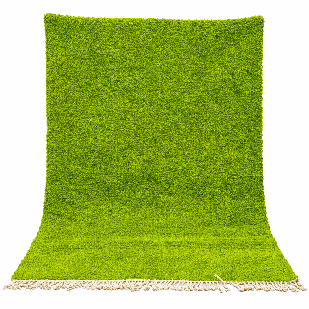 Solid green Moroccan wool rug with plush minimalist Berber texture