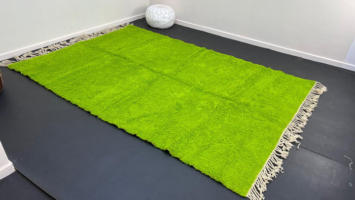Solid green Moroccan wool rug with plush minimalist Berber texture
