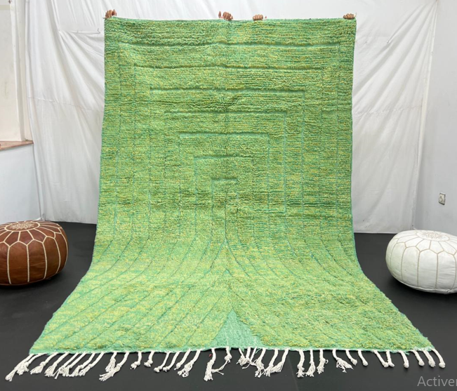 Green Moroccan wool rug with carved geometric lines and sculpted texture