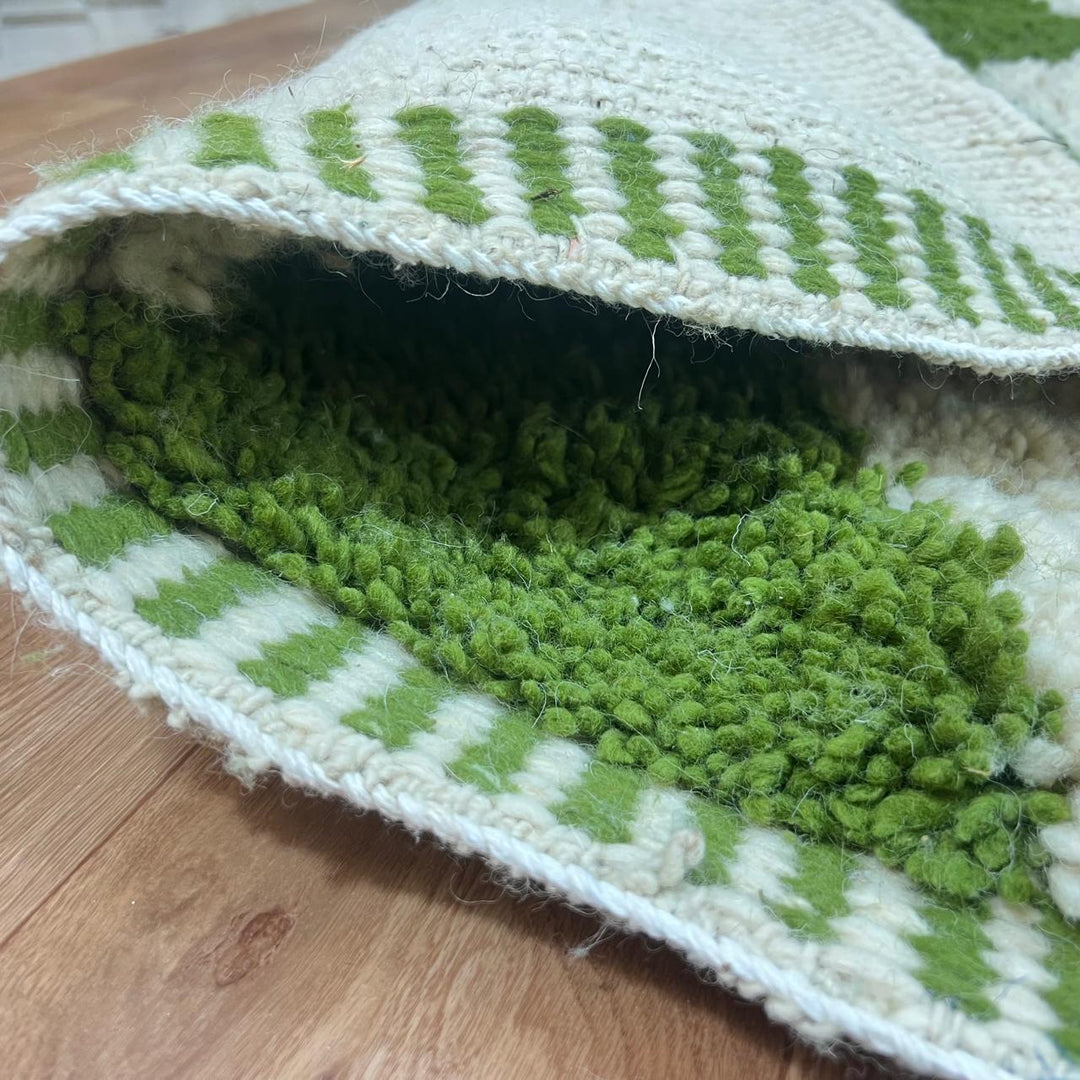 Green Moroccan wool runner rug with zigzag Berber pattern on ivory background, handmade chevron carpet