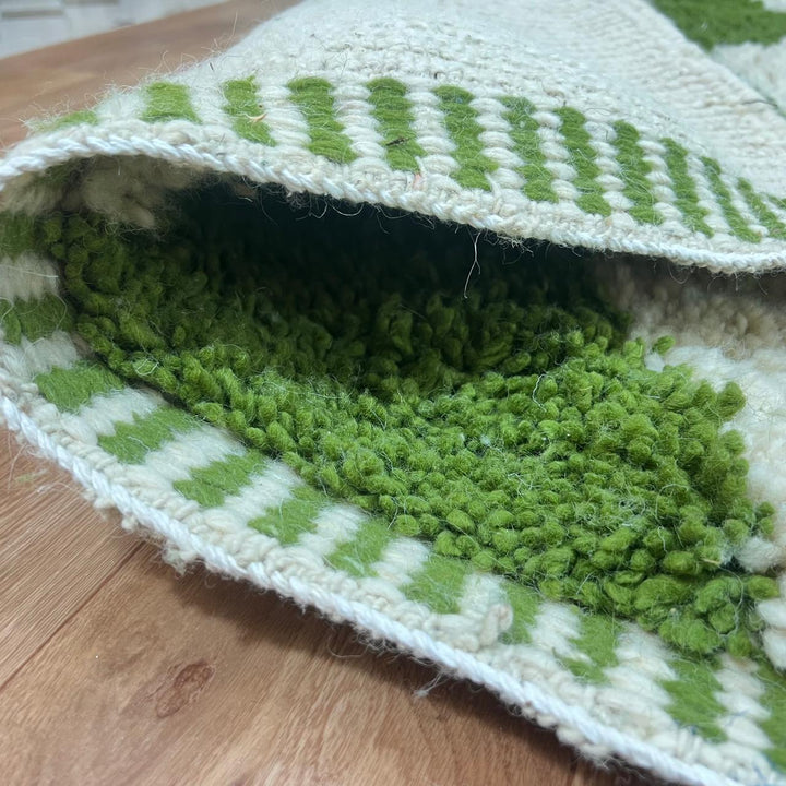 Green Moroccan wool runner rug with zigzag Berber pattern on ivory background, handmade chevron carpet