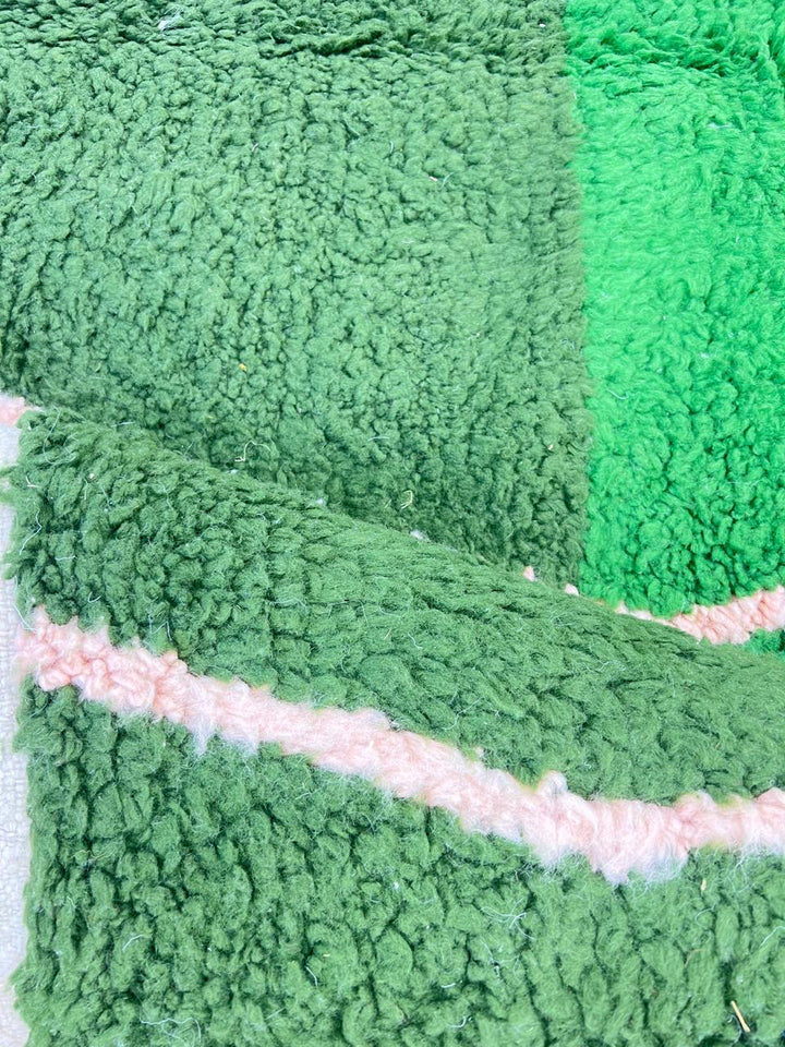 Green Moroccan runner rug handwoven in moss and olive wool with flowing ivory lines