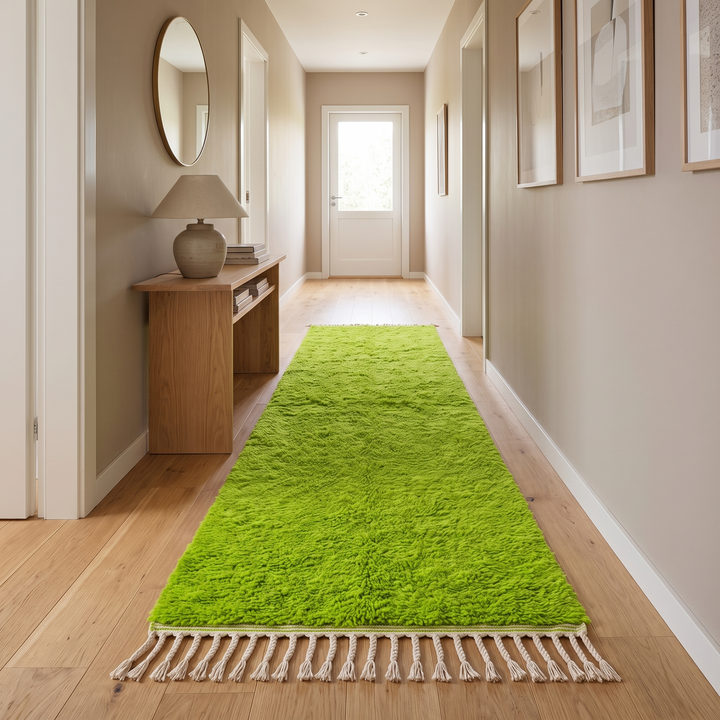 Green Moroccan runner rug in handmade wool shag texture with fringed ends