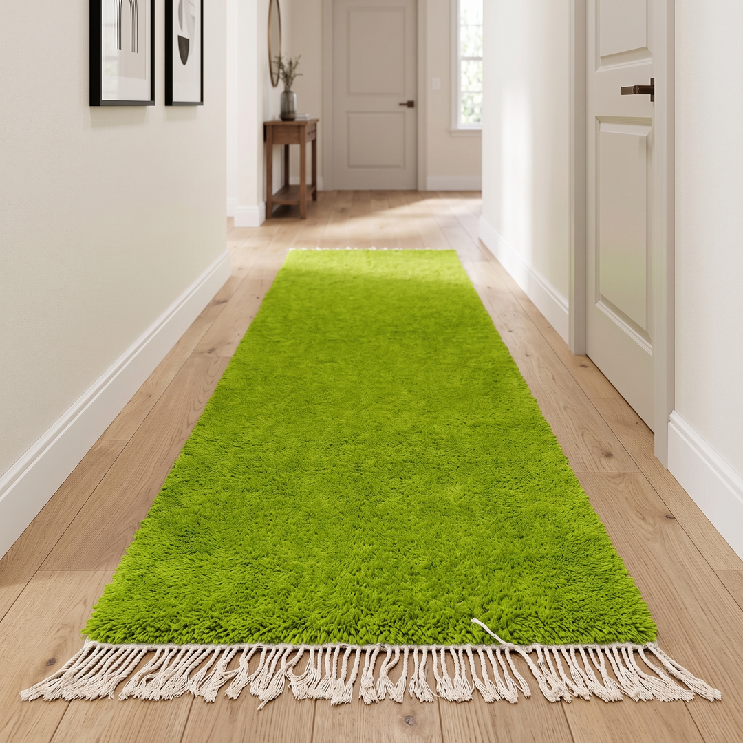 Green Moroccan runner rug in handmade wool shag texture with fringed ends