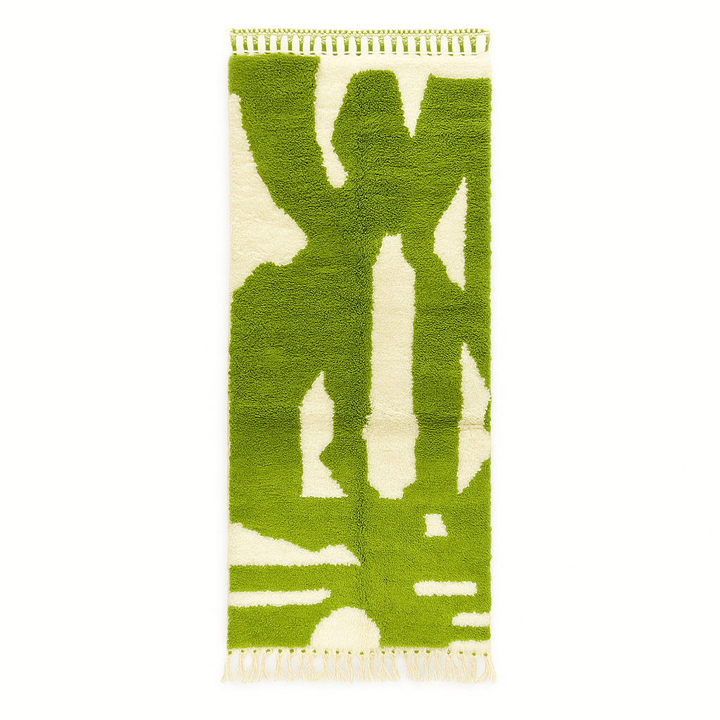 Handmade Moroccan runner rug with vibrant green and white abstract design, crafted from natural wool by Berber artisans.