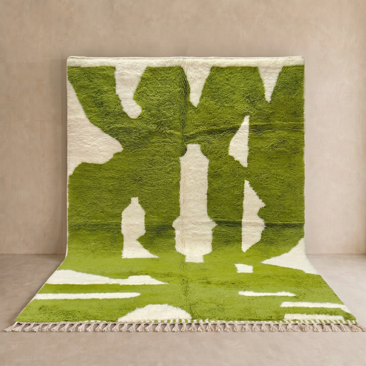 Handmade Moroccan wool rug with bold green and cream abstract geometric pattern
