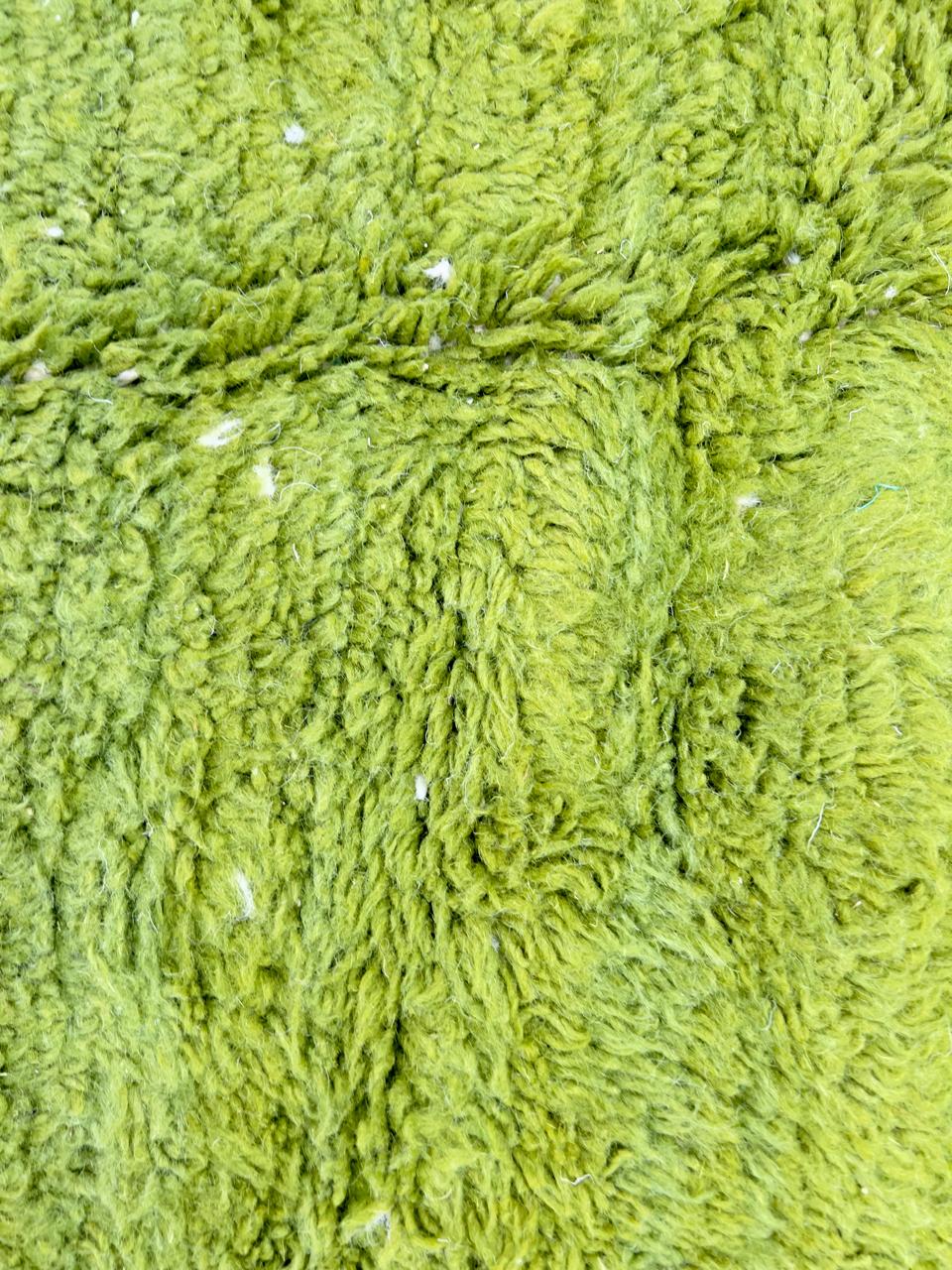 Handmade Moroccan wool rug with bold green and cream abstract geometric pattern