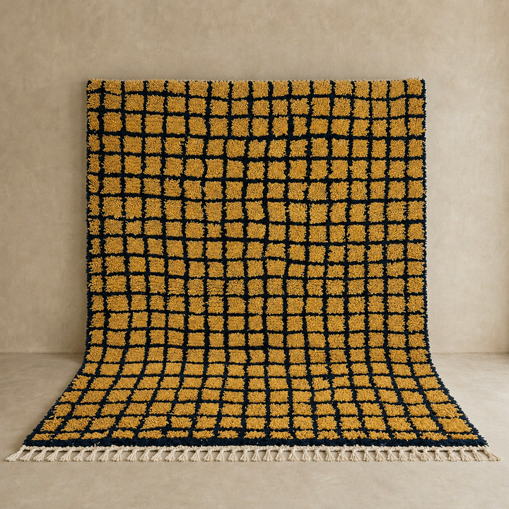 Handmade Moroccan wool rug with bold yellow and black grid design. Soft plush texture, modern style, and ethically crafted in Morocco.