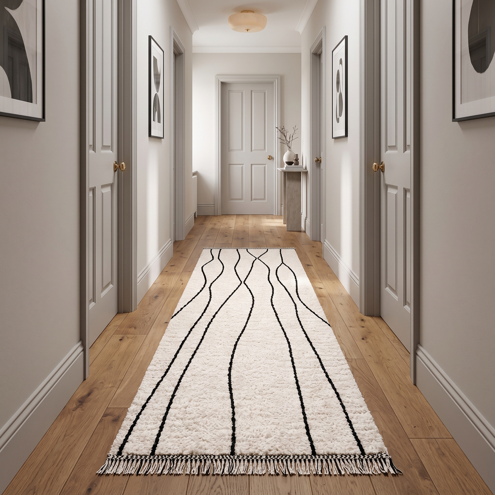Handmade Moroccan wool runner rug in white with black abstract lines, minimalist design for hallway or entryway.