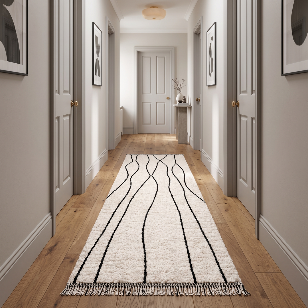 Handmade Moroccan wool runner rug in white with black abstract lines, minimalist design for hallway or entryway.