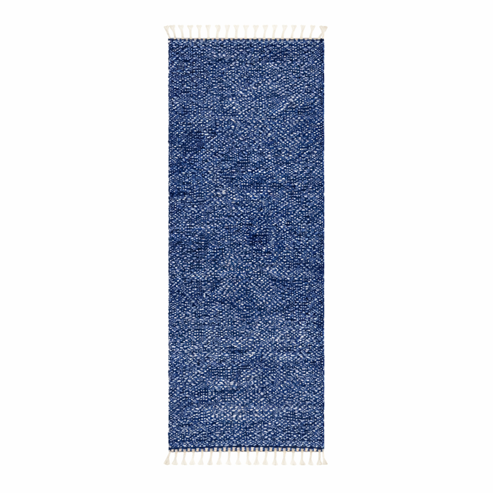 Close-up of deep indigo blue Moroccan wool rug with natural ivory speckled texture