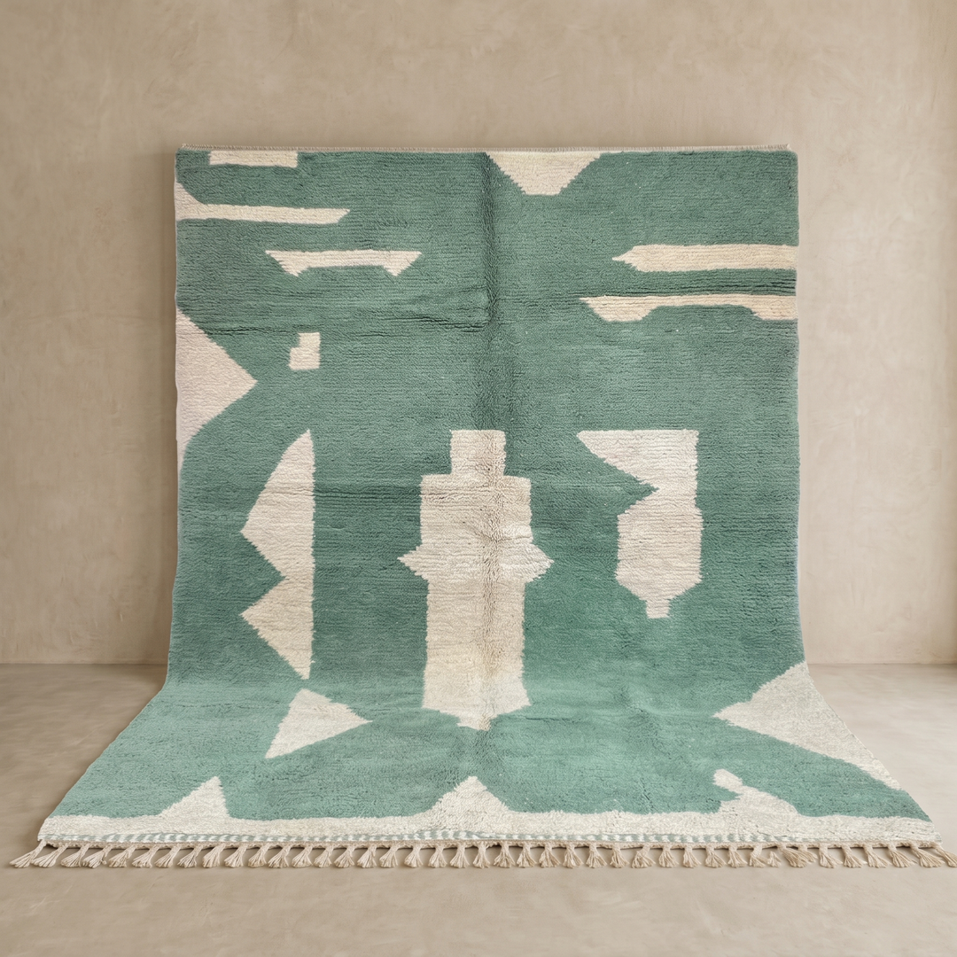 Handmade sage green Moroccan wool rug with ivory abstract geometric pattern and tassels