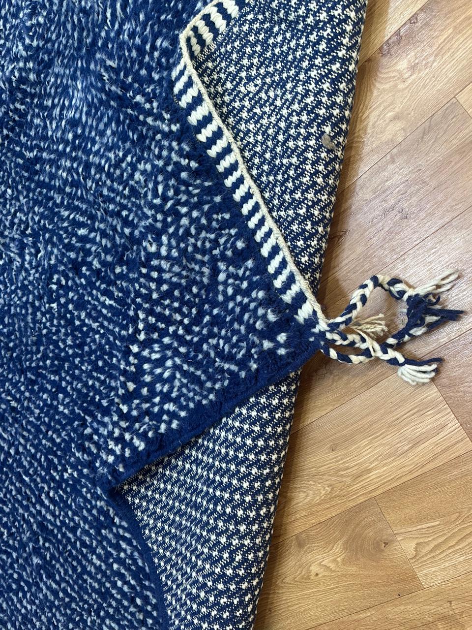 Indigo blue Moroccan wool rug with subtle textured pattern