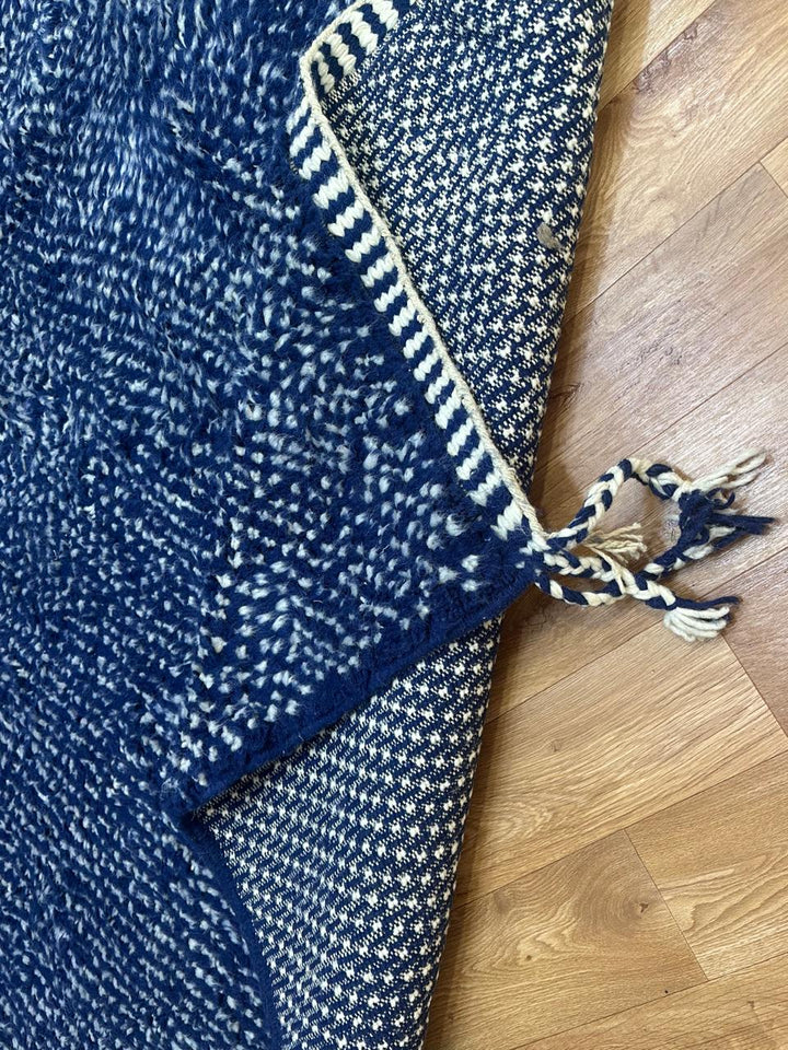 Indigo blue Moroccan wool rug with subtle textured pattern