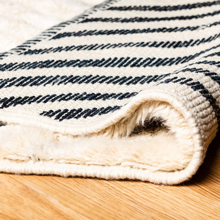 Handmade Moroccan Wool Rug with Black Geometric Triangle Pattern