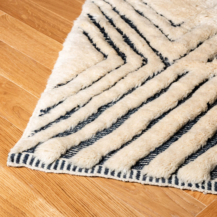 Handmade Moroccan Wool Rug with Black Geometric Triangle Pattern