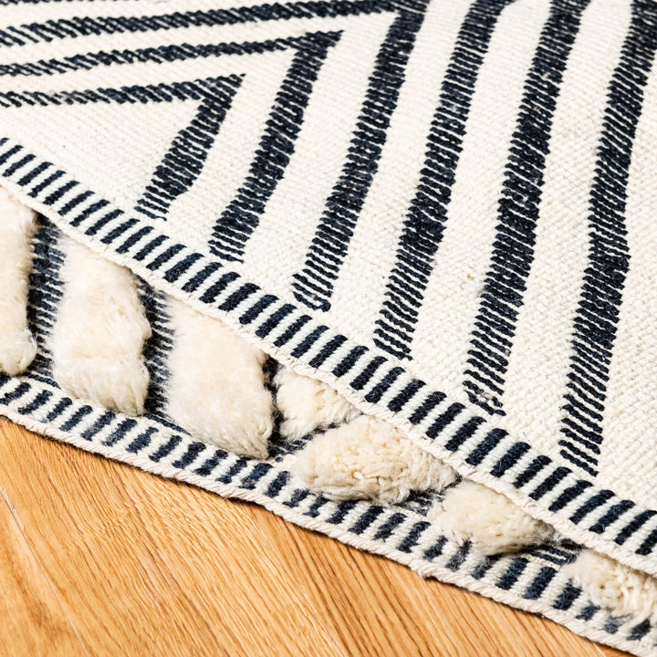 Handmade Moroccan Wool Rug with Black Geometric Triangle Pattern