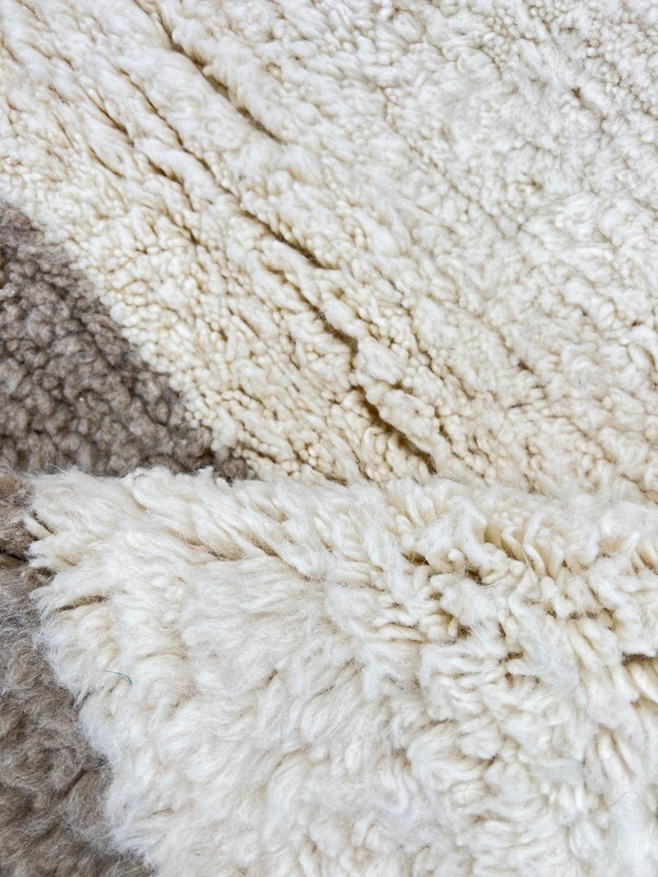 Handwoven Moroccan wool runner rug in white with sand border, minimalist modern design