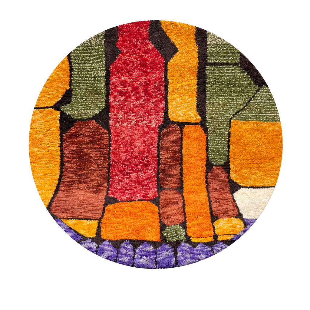 Handmade round Moroccan wool rug featuring colorful abstract geometric patterns in terracotta, olive green, orange, burgundy, purple, and ivory tones.