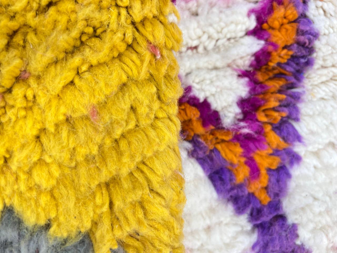 Handmade round colorful Moroccan wool rug with Berber geometric pattern