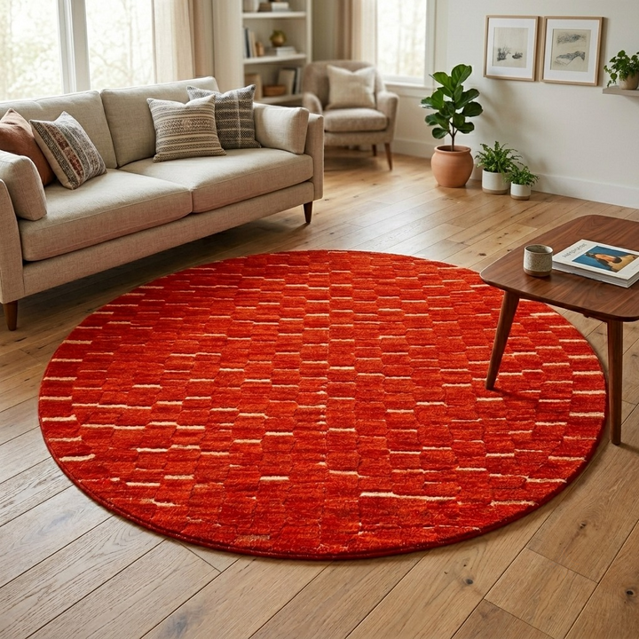 Handmade round Moroccan wool rug with rich textured surface and modern minimalist design.