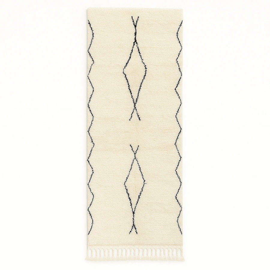 Handwoven white and black Moroccan wool runner rug with minimalist geometric lines, inspired by Beni Ourain design