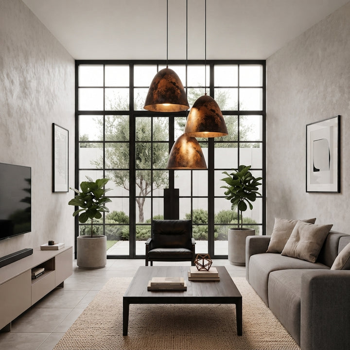 Handmade aged copper dome pendant light with a dark distressed patina in a modern industrial interior.