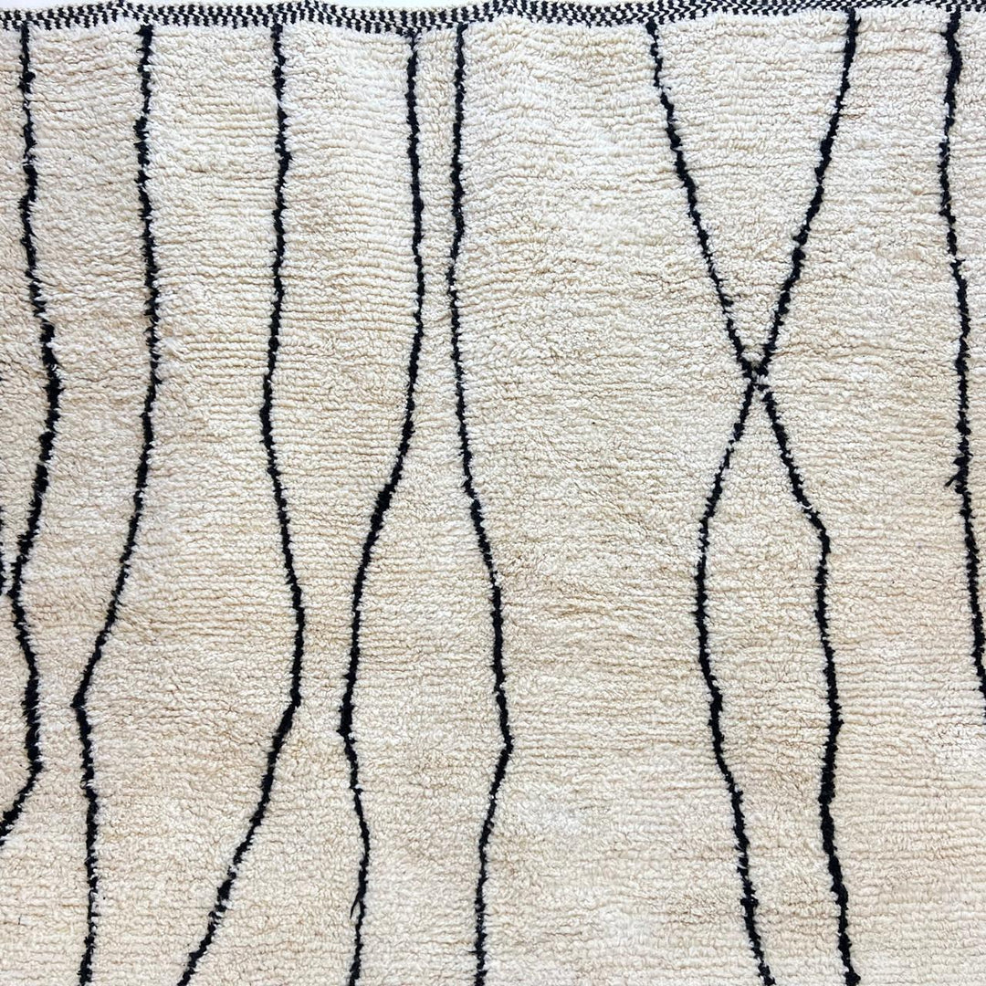 Handmade Moroccan wool runner rug in white with black abstract lines, minimalist design for hallway or entryway.