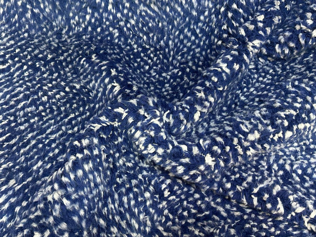 Close-up of deep indigo blue Moroccan wool rug with natural ivory speckled texture