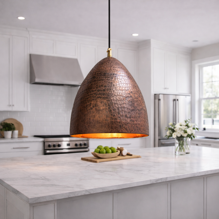 Modern kitchen with a copper pendant light fixture.