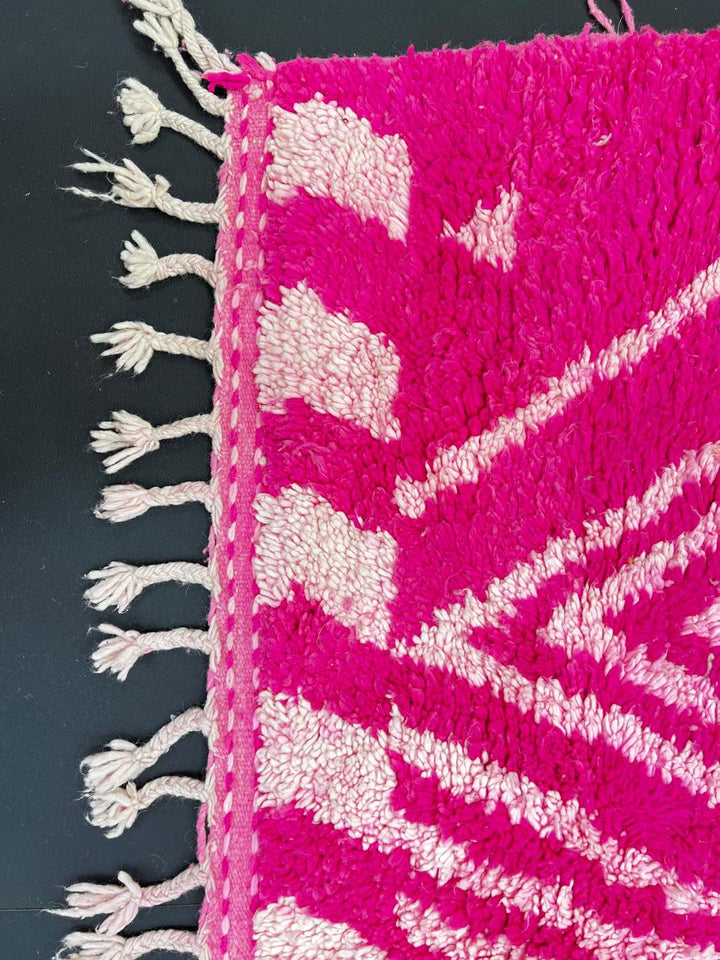 Hot pink Moroccan wool rug with ivory diamond geometric design handmade by Berber artisans