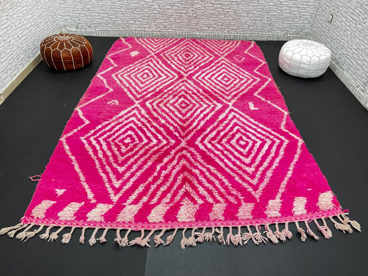 Hot pink Moroccan wool rug with ivory diamond geometric design handmade by Berber artisans