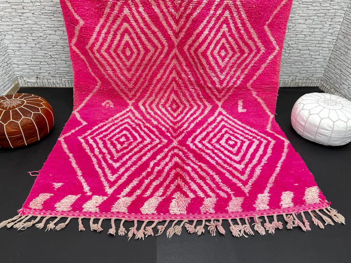 Hot pink Moroccan wool rug with ivory diamond geometric design handmade by Berber artisans