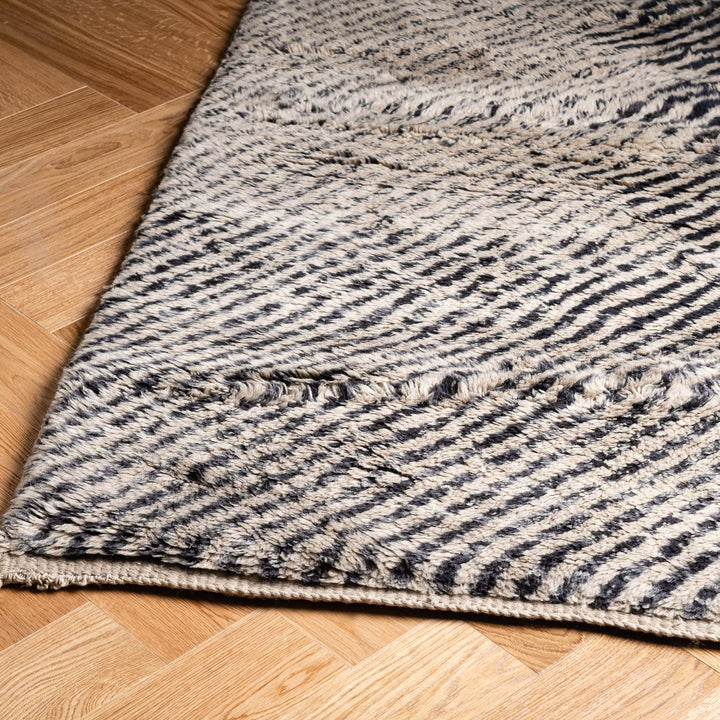Hypnotic Beni Mrirt Rug – Black & Beige Wool Artwork