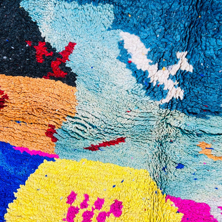 Vintage Moroccan abstract rug with bold colors, featuring red, blue, pink, and mustard tones. Handwoven Berber wool rug from Morocco.
