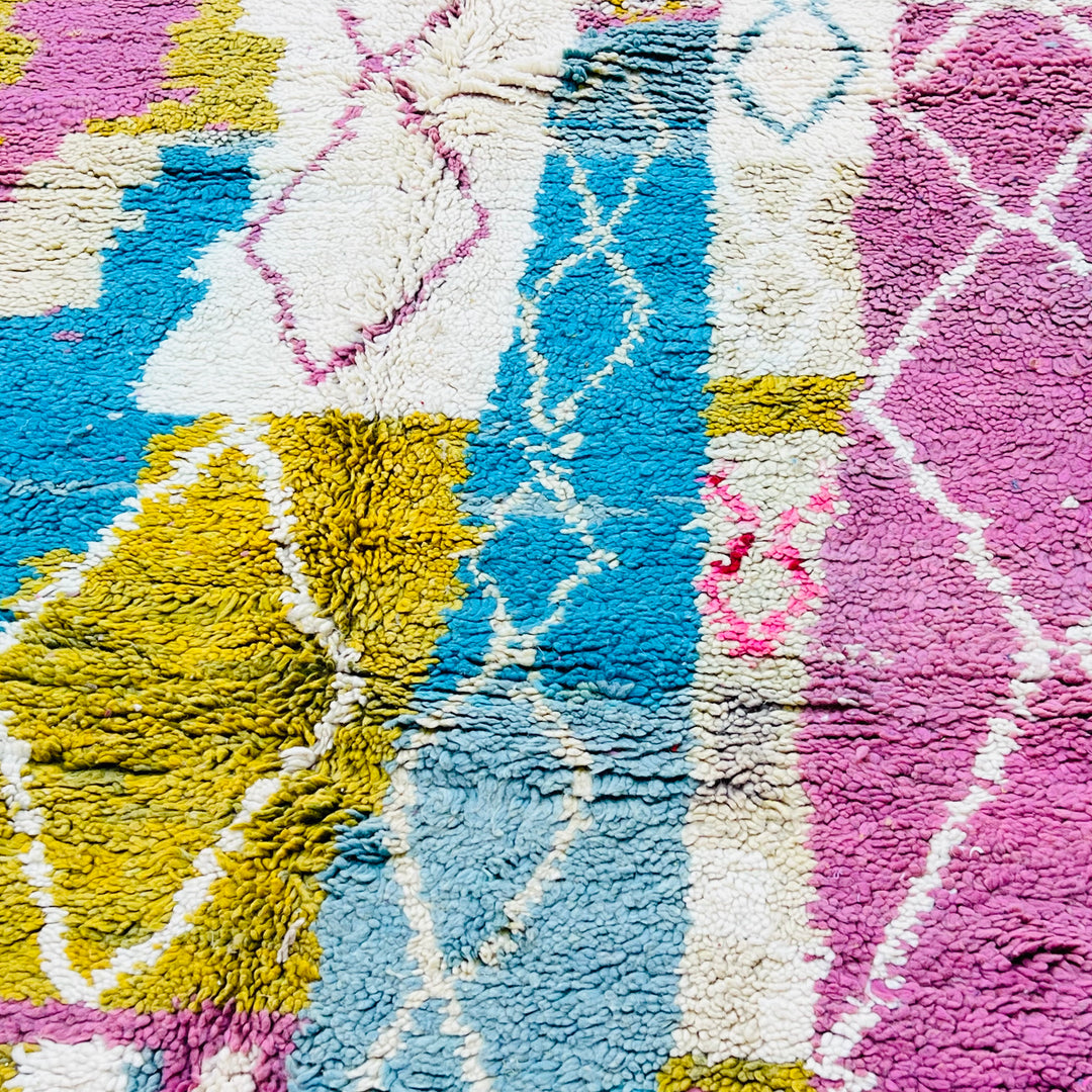 Vintage Moroccan Berber rug with abstract pink, blue, mustard, and ivory diamond patterns in wool. Handwoven, 8.5x5.3 ft.
