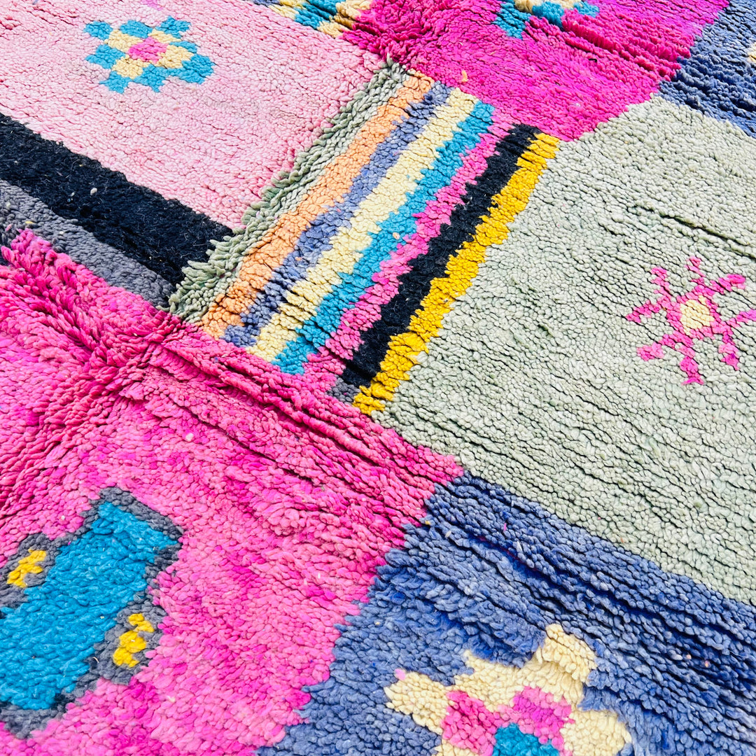 Colorful vintage Moroccan Berber wool rug with pink, mustard, aqua patchwork. Handcrafted geometric design from the Atlas Mountains.