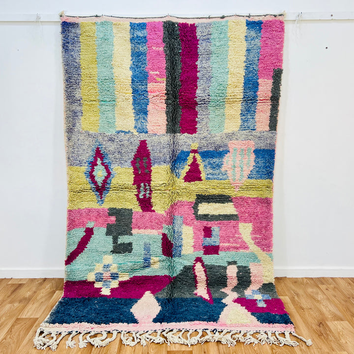 Vibrant 8x5 ft Moroccan Berber rug with colorful geometric patterns, handwoven wool. Perfect for boho interiors. Moroccan Rugs for Sale.