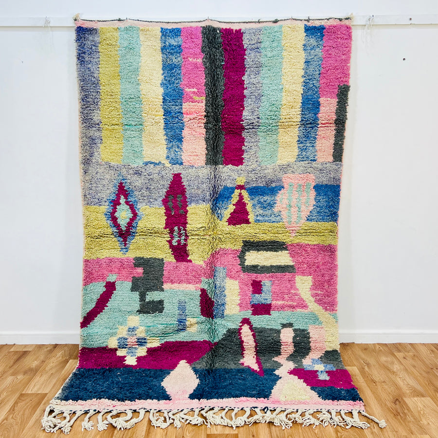 Vibrant 8x5 ft Moroccan Berber rug with colorful geometric patterns, handwoven wool. Perfect for boho interiors. Moroccan Rugs for Sale.