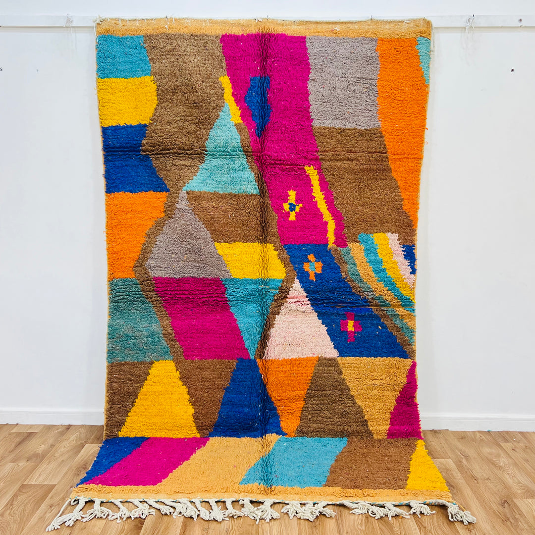Vintage Moroccan rug with geometric design in brown, pink, turquoise, yellow, blue. Handmade wool 8.2x5 ft. Berber artistry.
