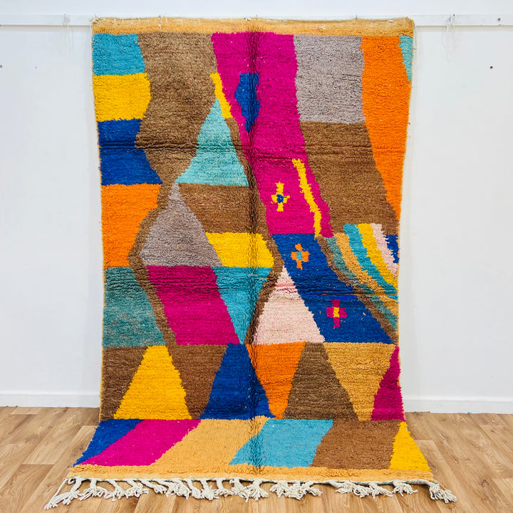 Vintage Moroccan rug with geometric design in brown, pink, turquoise, yellow, blue. Handmade wool 8.2x5 ft. Berber artistry.