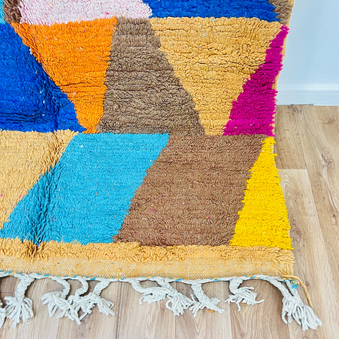 Vintage Moroccan Rug with geometric patchwork in earthy brown, pink, turquoise, yellow, and blue. Handwoven by Berber women.